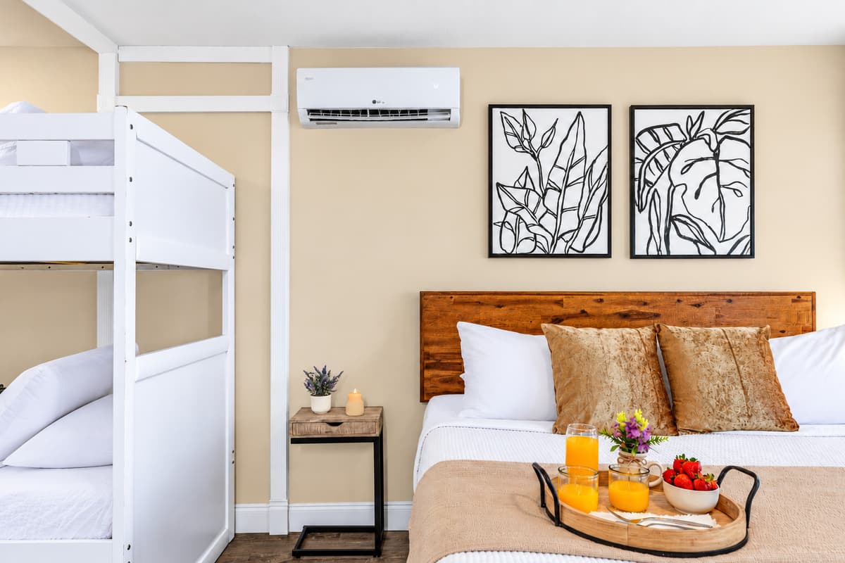 Family-friendly bedroom with a king bed and built-in twin bunk beds.