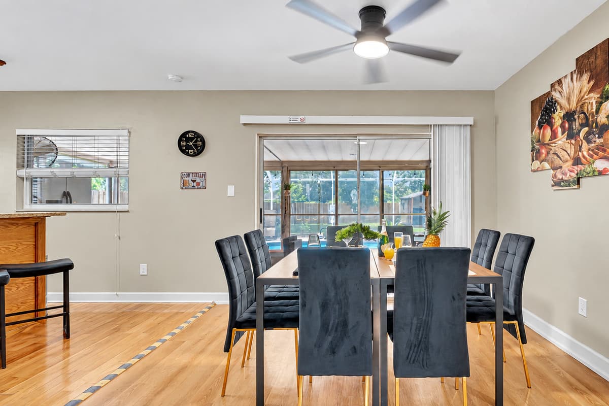 As you dine, enjoy the convenience of a sliding door that grants you easy access to the patio and pool area.