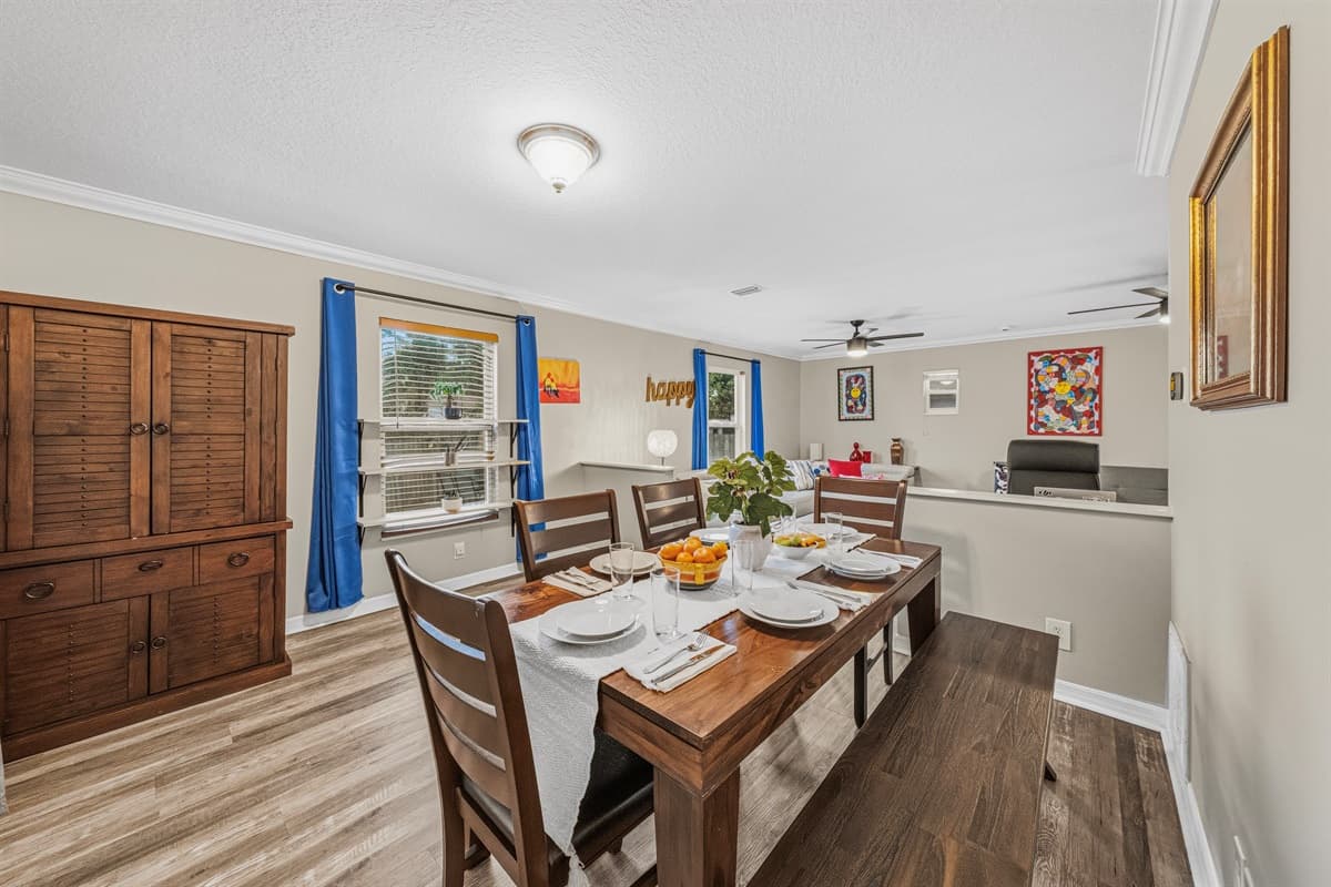 Large dining area with seating for the whole group, flowing seamlessly into the living space.