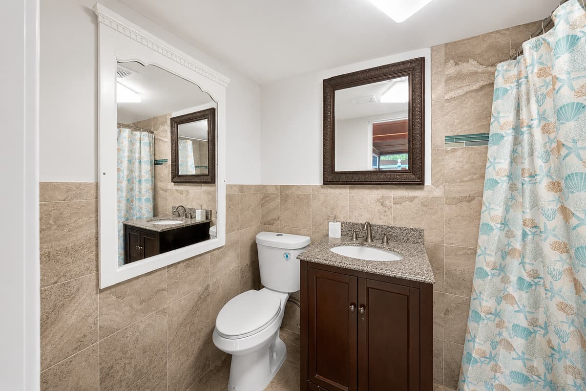 Outdoor Patio/Pool Bathroom
Convenient outdoor patio and pool bathroom, providing easy access for guests enjoying the pool and entertainment area.