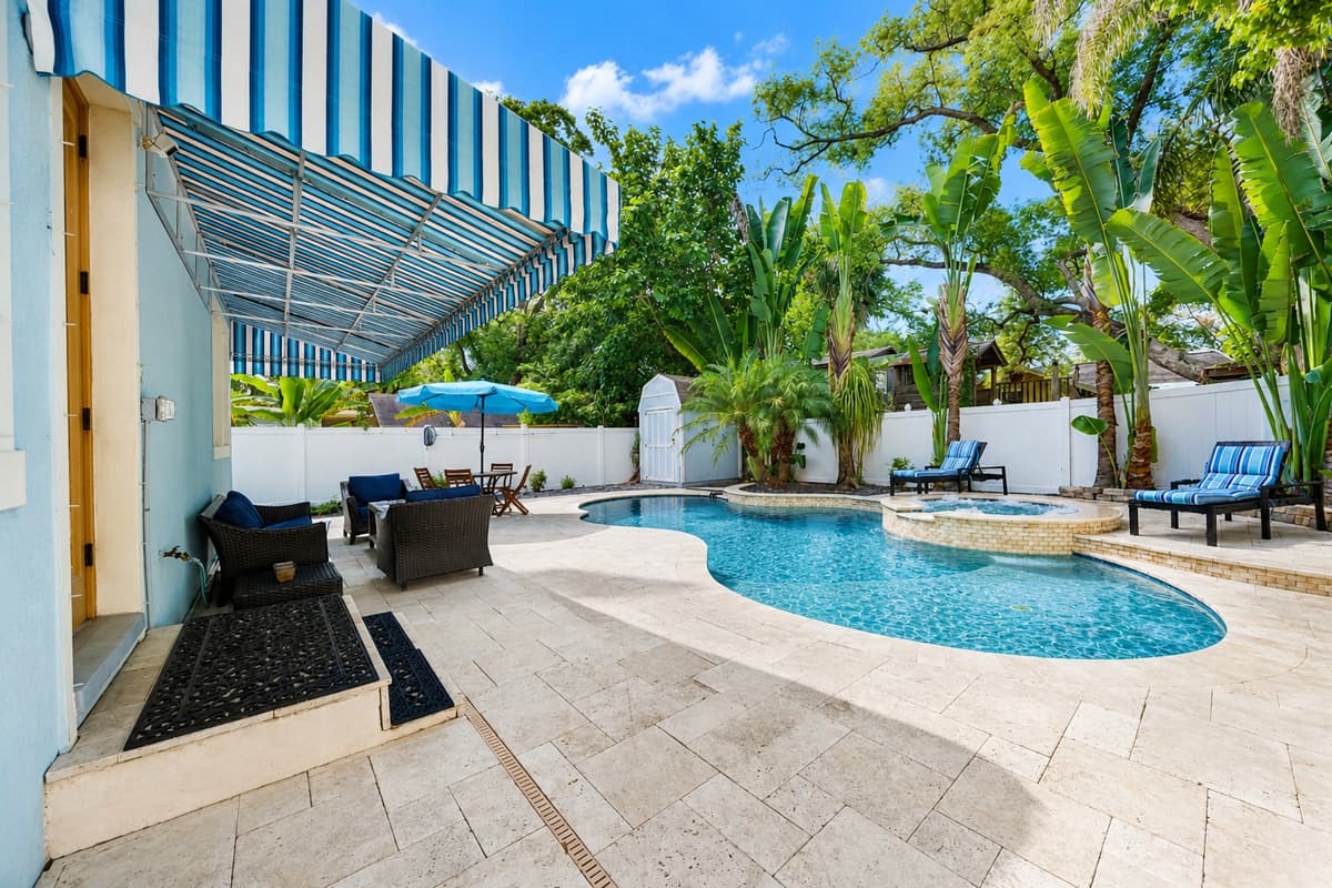 Enjoy your private backyard oasis with a sparkling pool, relaxing spa, covered patio, and plenty of room to lounge in the Florida sunshine.