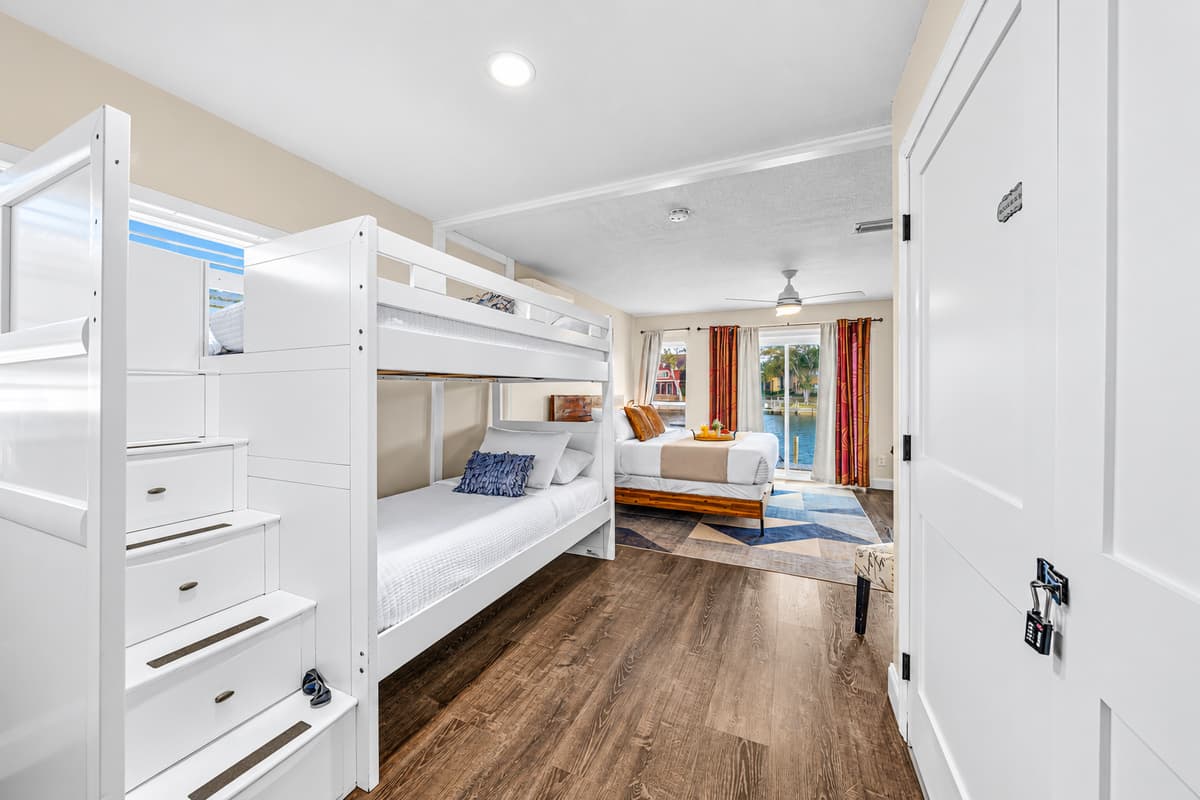 Large family suite with a king bed, bunk beds, and plenty of space for everyone.
