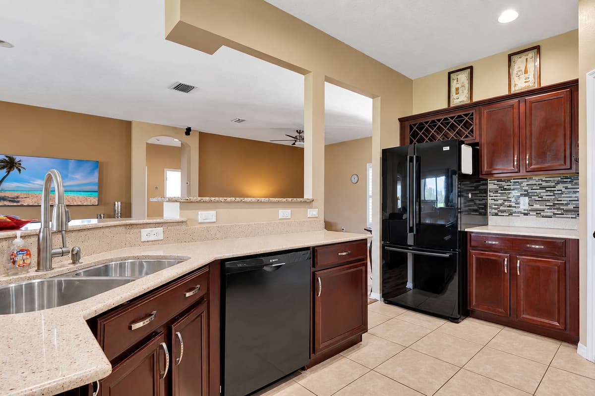 Their rich, warm tones provide a striking contrast to the sleek black appliances, creating a visual feast that delights the senses.