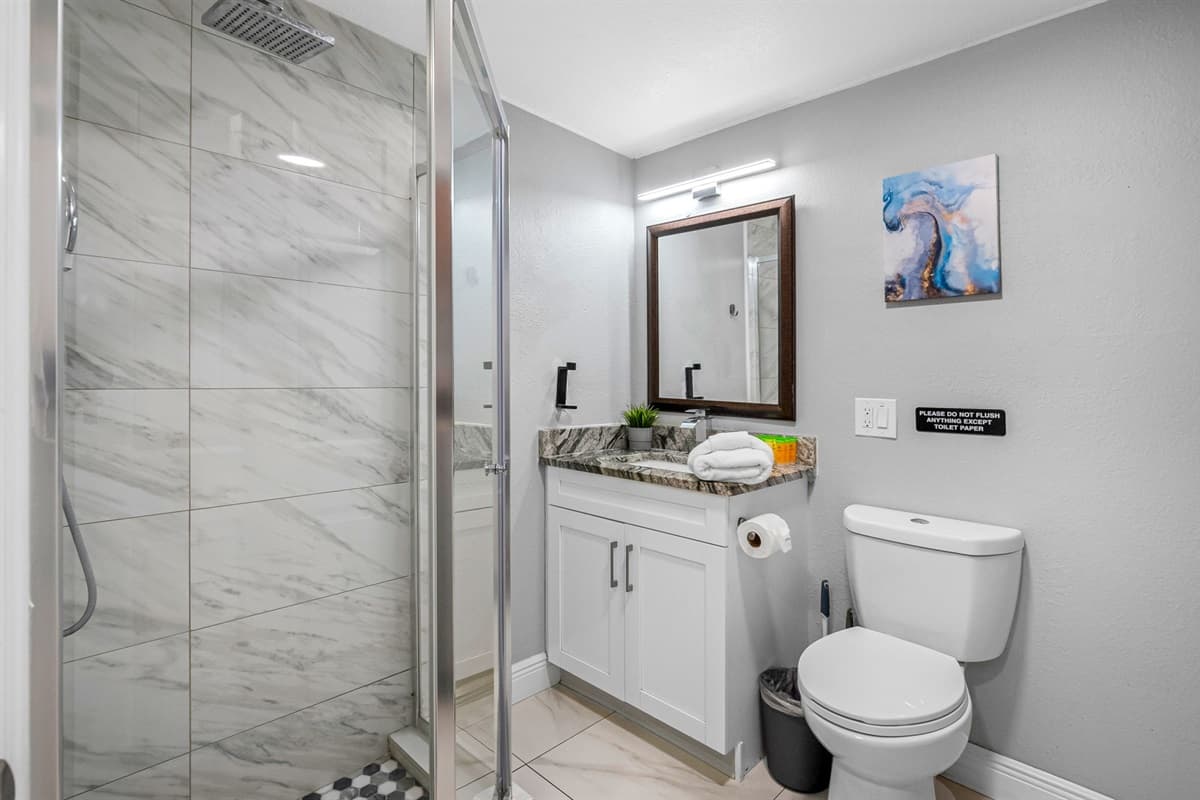 Designed with comfort and sophistication in mind, this bathroom offers both beauty and function.
