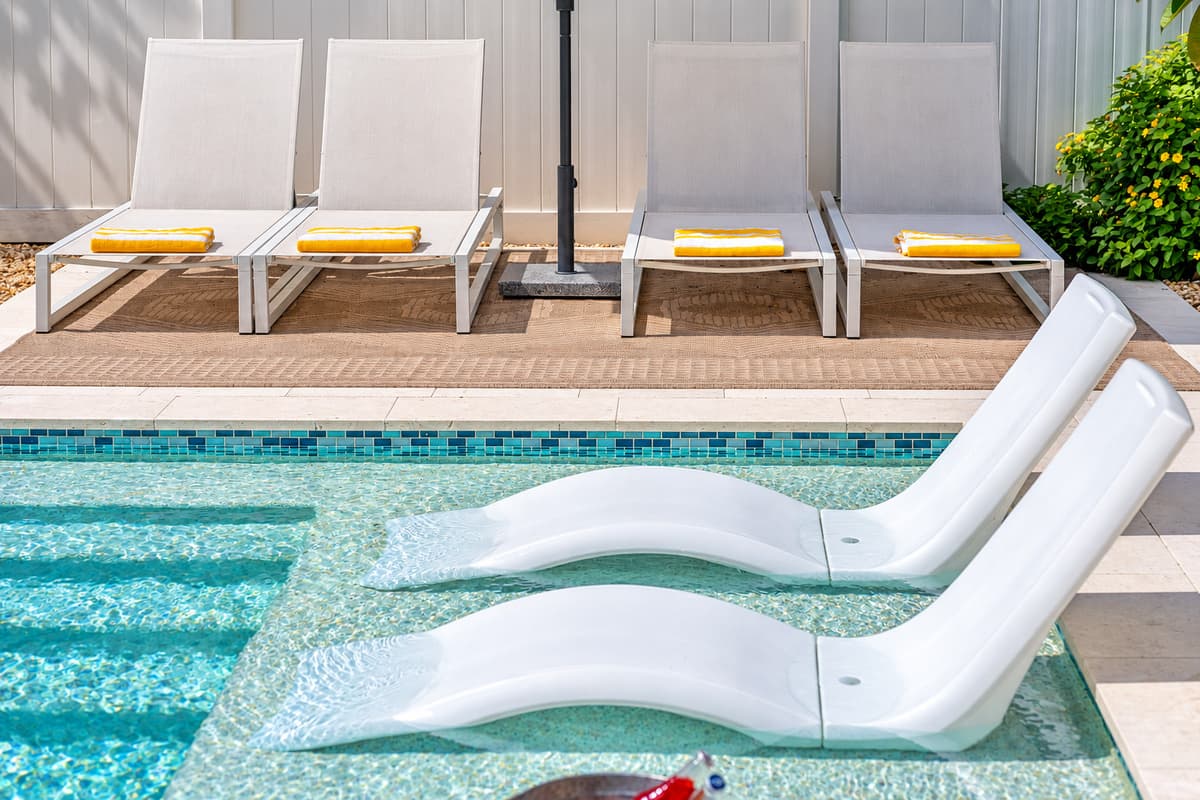 Lounge poolside with a cold drink, fire up the grill, or gather around the outdoor dining table with your crew.