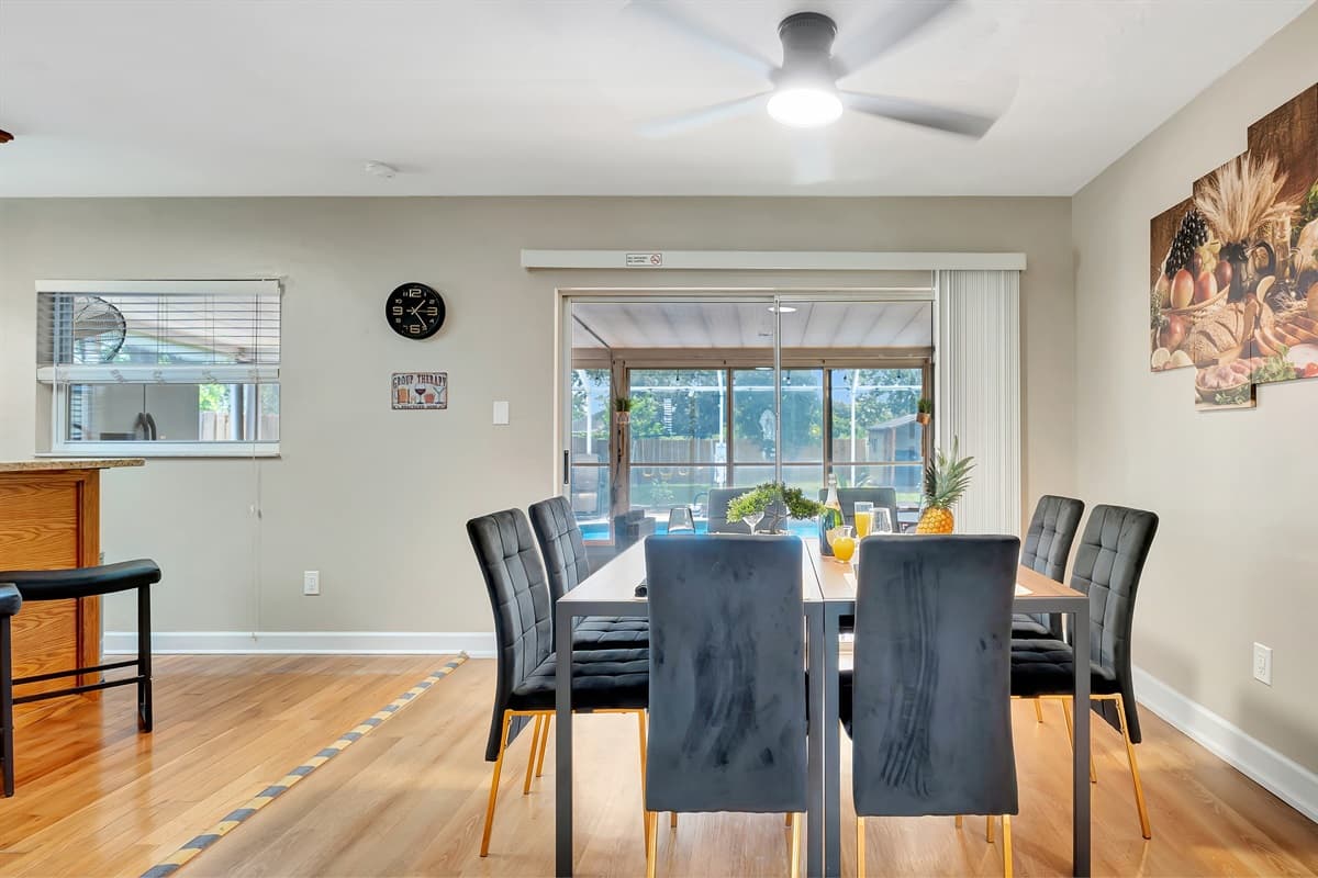 As you dine, enjoy the convenience of a sliding door that grants you easy access to the patio and pool area.