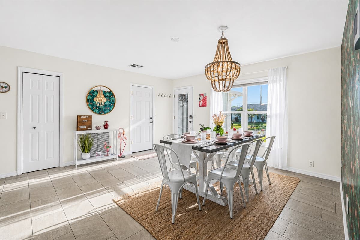 Bright and inviting dining area with ample seating and modern coastal décor.