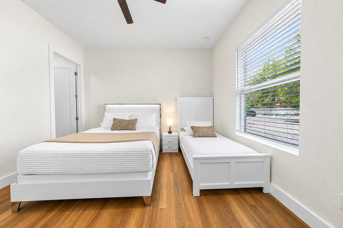 Cozy bedroom with clean design, comfortable bed, and peaceful atmosphere.