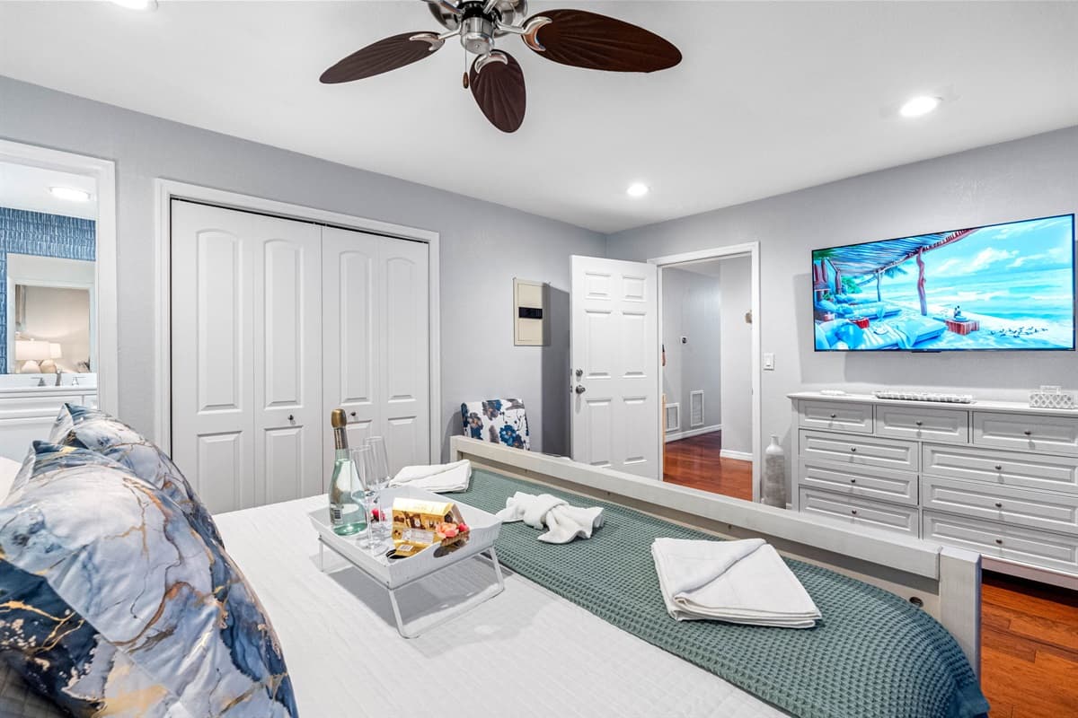 This spacious and inviting bedroom is elegantly furnished with stylish accents.