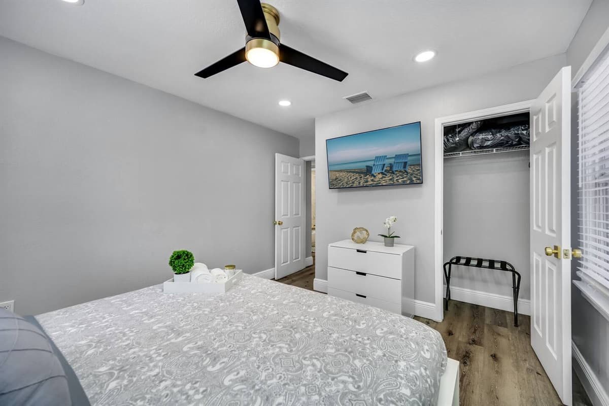 Elegant bedroom with a king-size bed, drawers, closet, and its own TV. Feel at home while you're on your home away from home! 