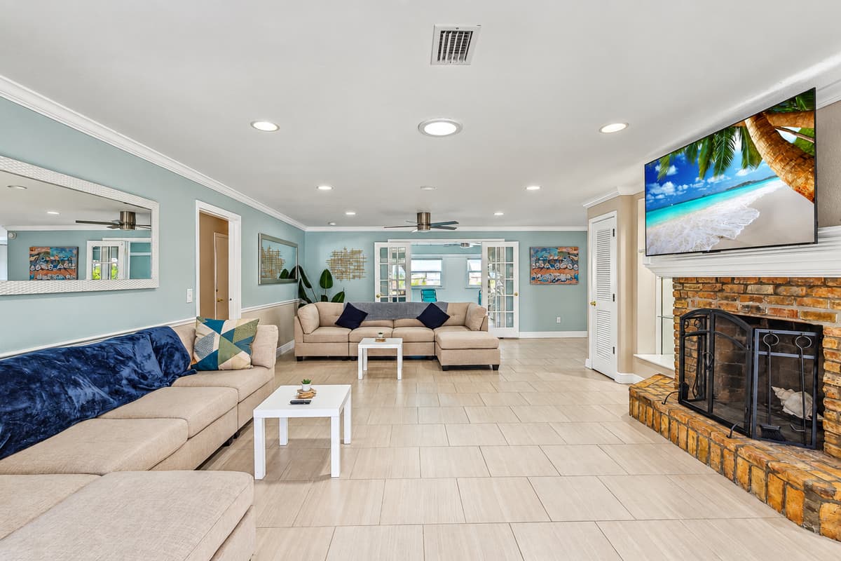 Living room with plenty of seating for the family and large UHD Smart TV