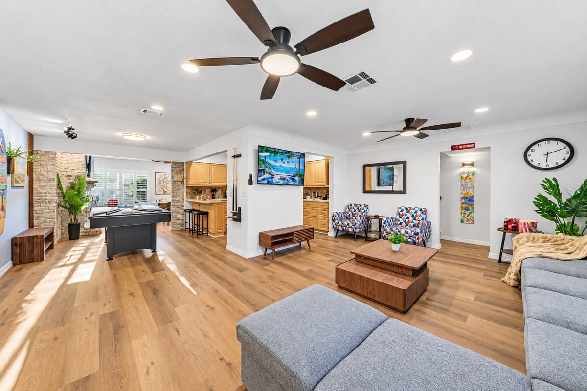 Expansive living area with natural light and seamless flow into dining and entertainment spaces