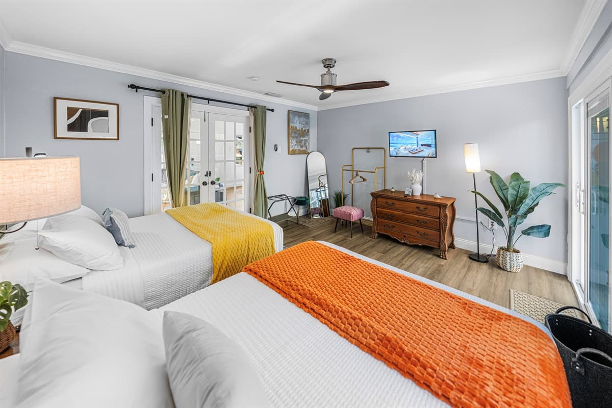 With two comfortable double beds, this bedroom is ideal for families or friends seeking a restful night’s sleep.