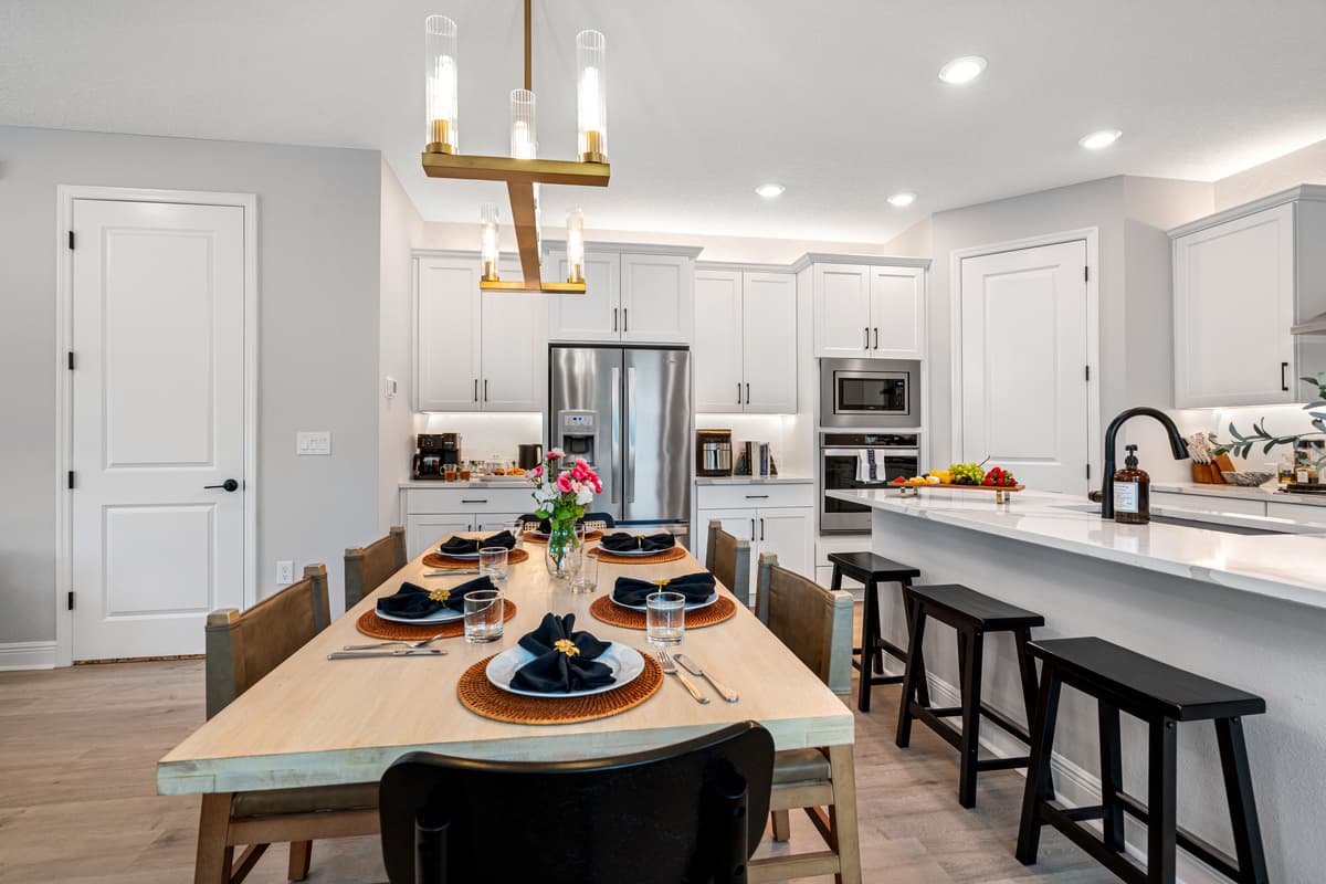 The table's rich wood finish showcases its timeless elegance, blending seamlessly with any décor style and adding a sense of classic charm to the room.