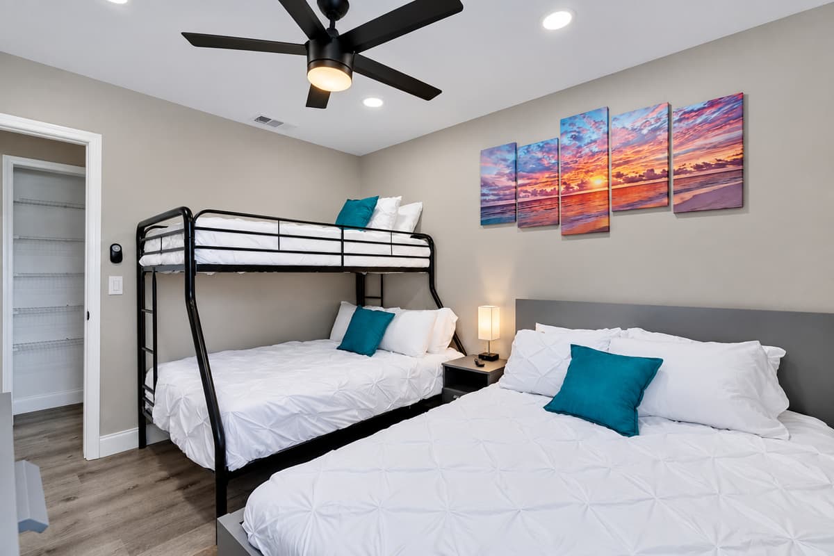 Spacious bedroom with a comfortable huge bed and a single over twin bunkbed. This room also has its own TV. Feel at home in your home away from home. If you think you'd enjoy your trip to this property, send us a message now!