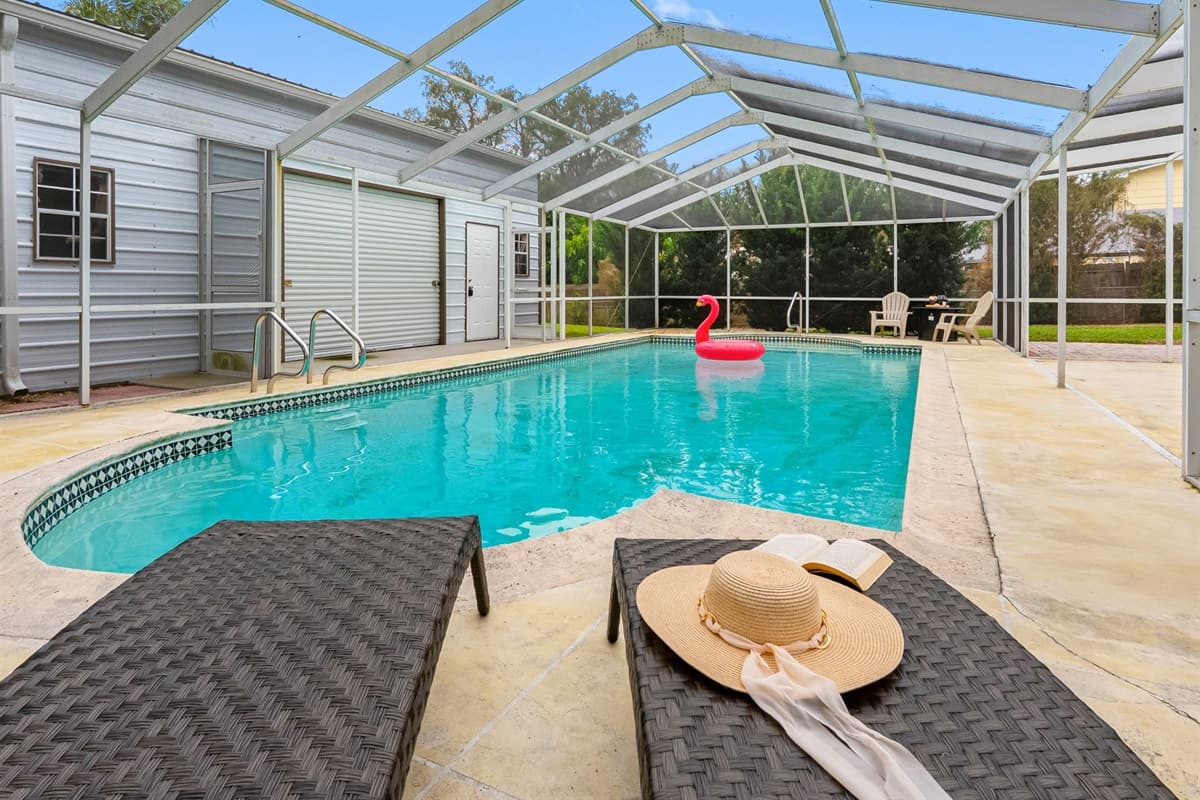 Cool off in this private backyard pool, surrounded by a peaceful outdoor setting.