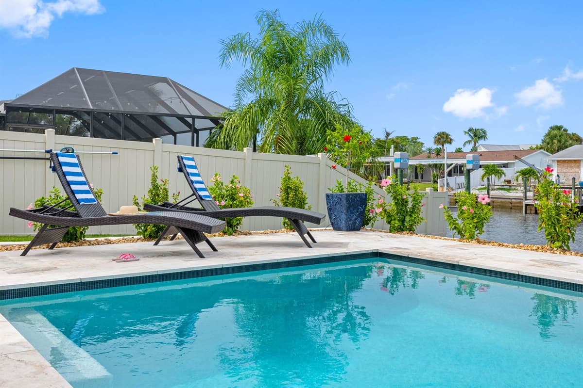 Sparkling water, palm trees, and peaceful views create the perfect vacation atmosphere.