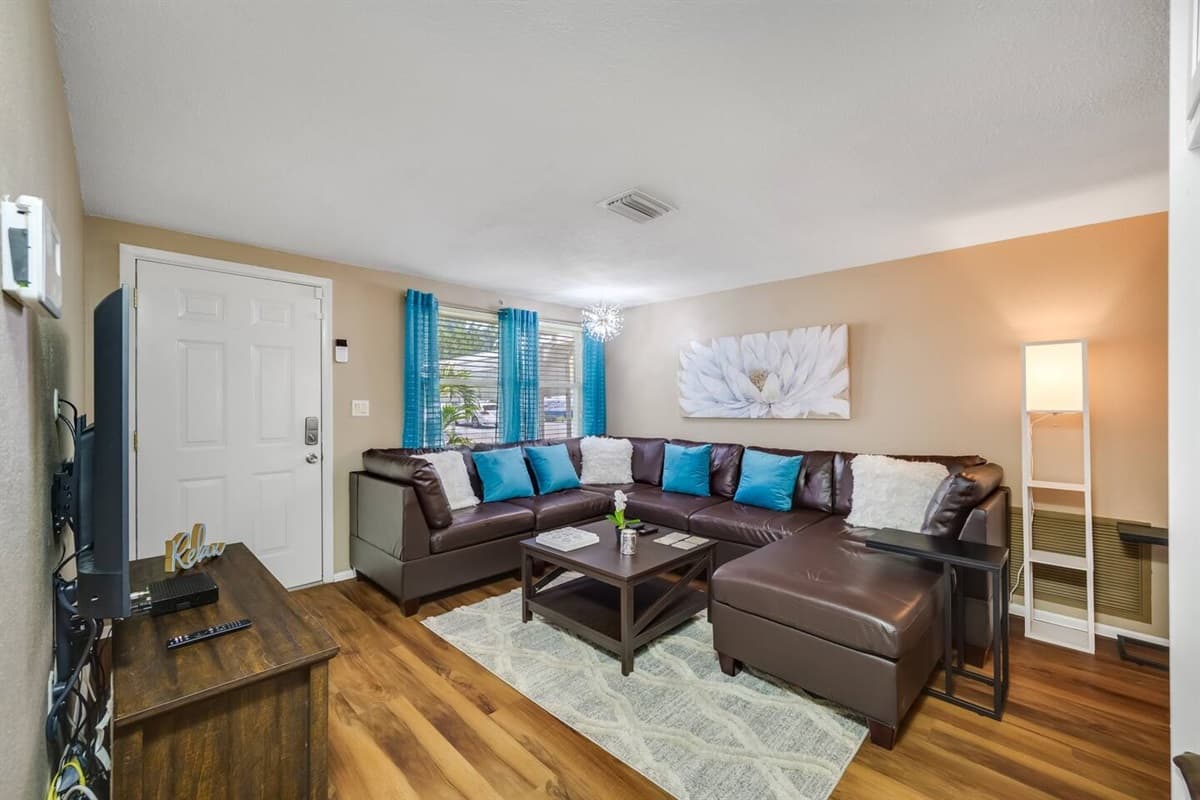 Modern living room equipped with a large flat-screen smart TV that will stream Netflix, HBO, YoutubeTV, and others. If you have any questions at all, please send us an inquiry today!