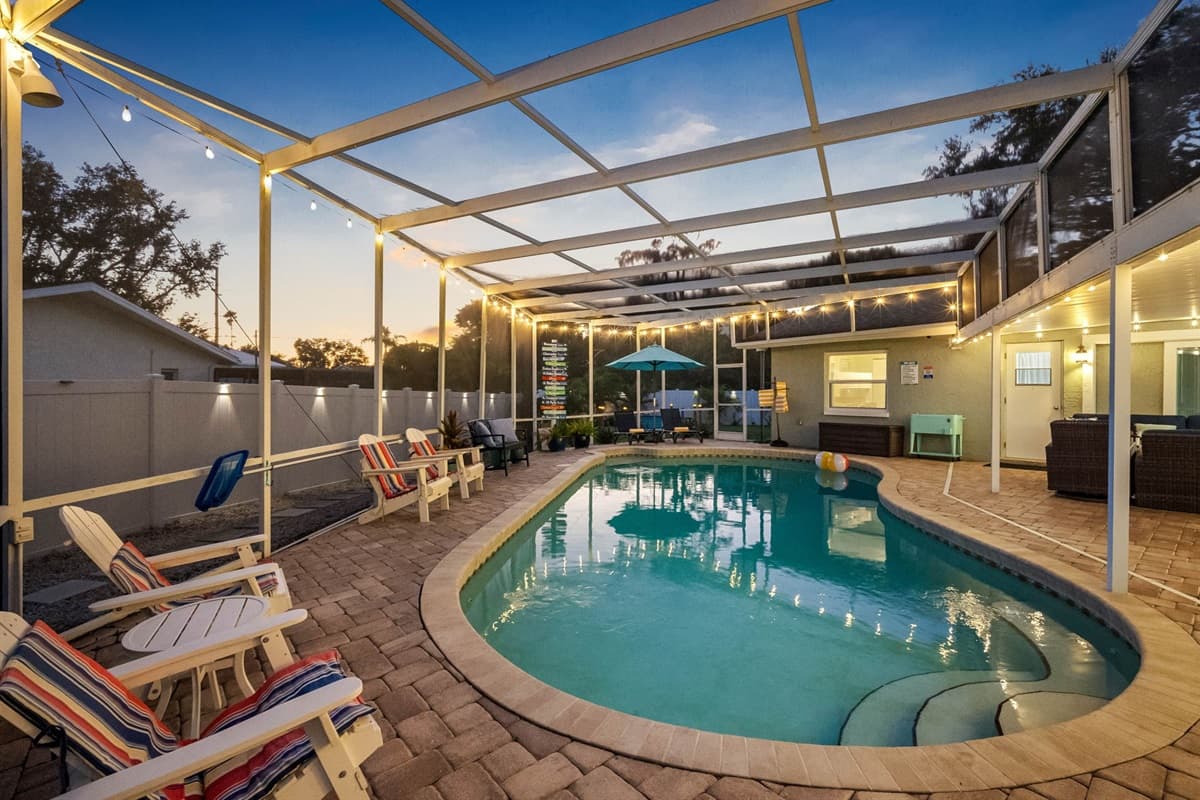 As the sun sets, string lights transform this space into a tranquil retreat for evening swims, quiet conversations, or family fun under the stars.