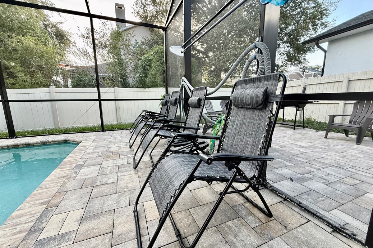 Stretch out and soak up the sun on multiple reclining loungers or gather around the shaded seating area for poolside conversations, card games, or reading a good book.