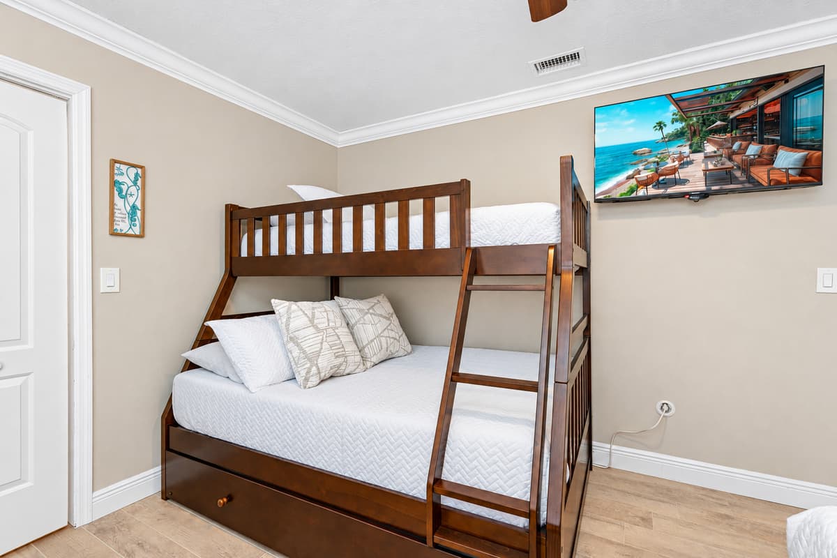 The room's layout is thoughtfully planned to maximize comfort and convenience, ensuring ample space for everyone to relax and enjoy their stay.