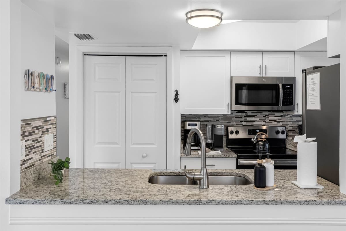 Stocked with cookware, utensils, and modern appliances, this kitchen is ready for everything from quick breakfasts to gourmet dinners.