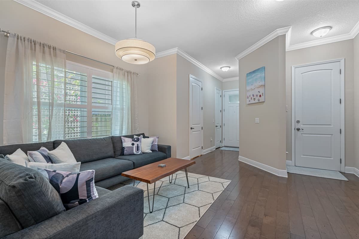 This incredible living area has a beautiful couch, high ceiling, and a spacious open areal! Relax and make memories with family and friends here! Book it now!