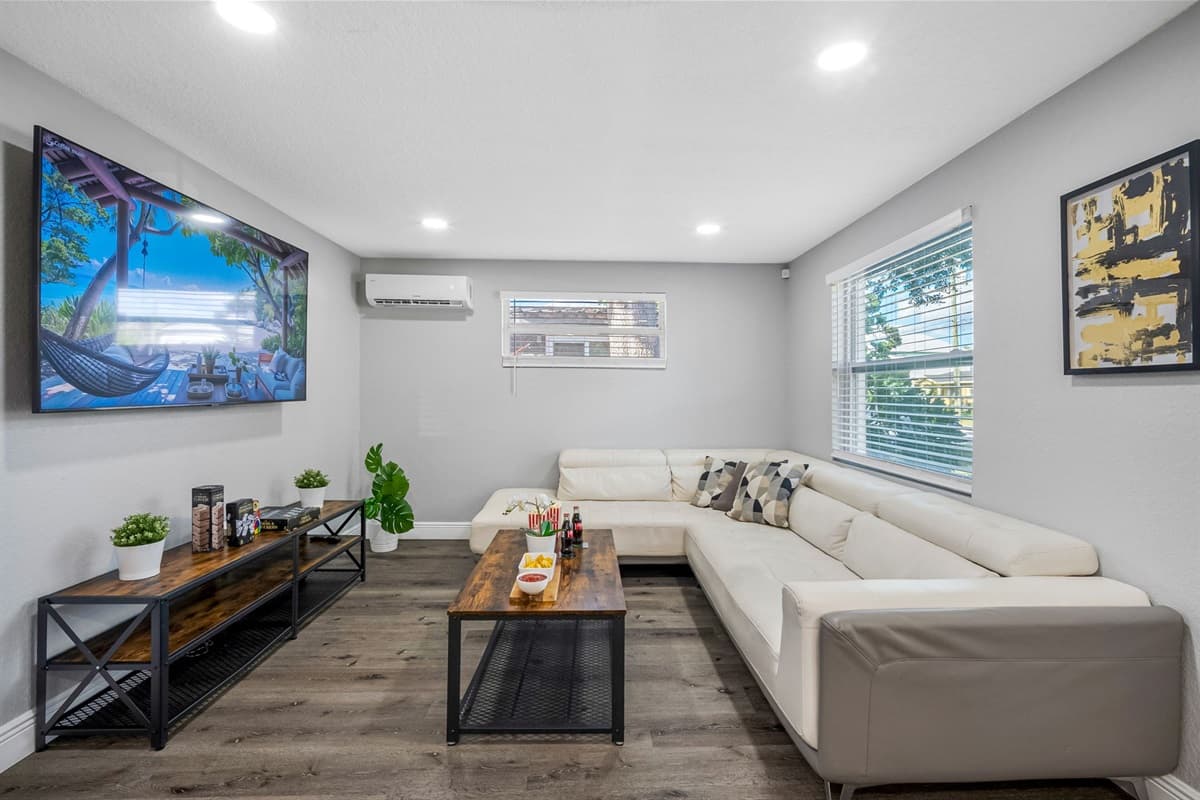 Unwind in this inviting lounge area complete with a spacious leather sectional and entertainment setup for the ultimate comfort.
