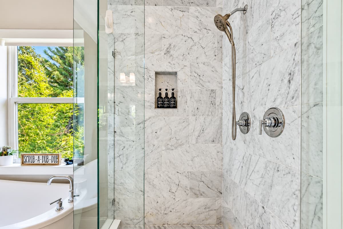 The decor of this Bathroom exudes a sense of tranquility and refinement, with clean lines, neutral tones, and tasteful accents that create a soothing atmosphere.