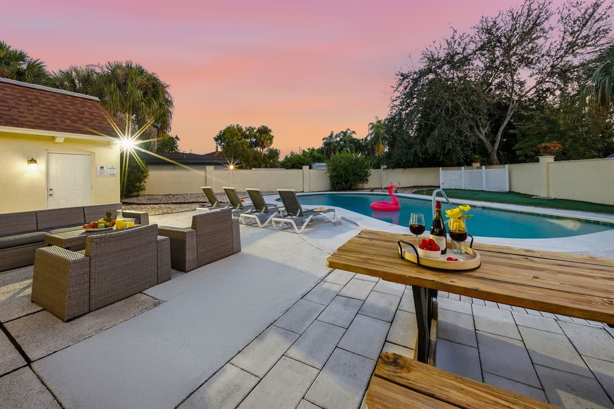 Enjoy the ultimate outdoor experience with a private pool, cozy lounge seating, and a picnic-style dining area perfect for sharing meals outdoors.