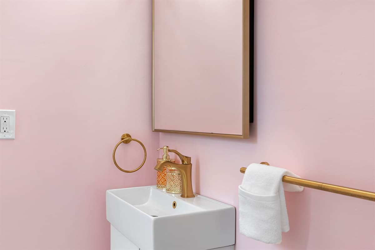 The bathroom includes all the essentials, including a bathtub, perfect for a soothing soak after a day of outdoor adventures.