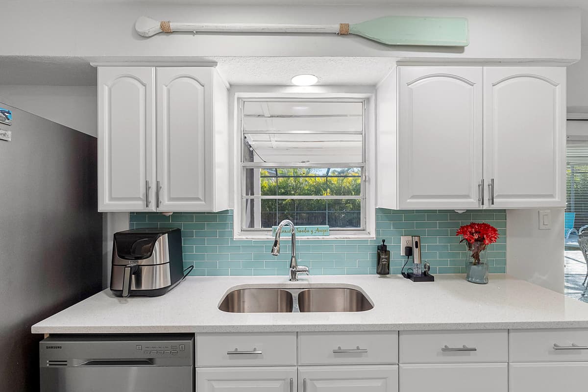 This fully equipped kitchen boasts state-of-the-art appliances, including a stainless steel refrigerator with ample storage space to keep your groceries fresh throughout your stay.
