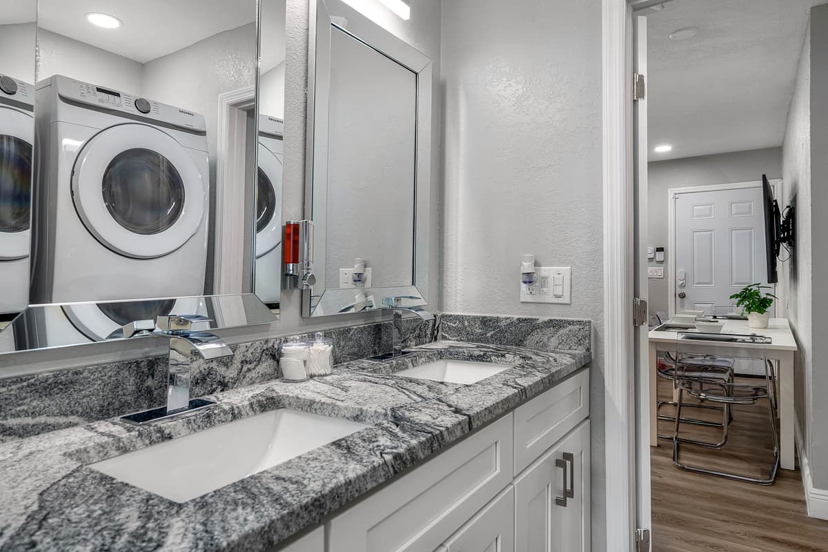 Our beautiful bathroom is equipped with his and hers sink, toilet, bathtub, and shower. Enjoy a relaxing bath after a long day of travel from your home to your home away from home. If you thin