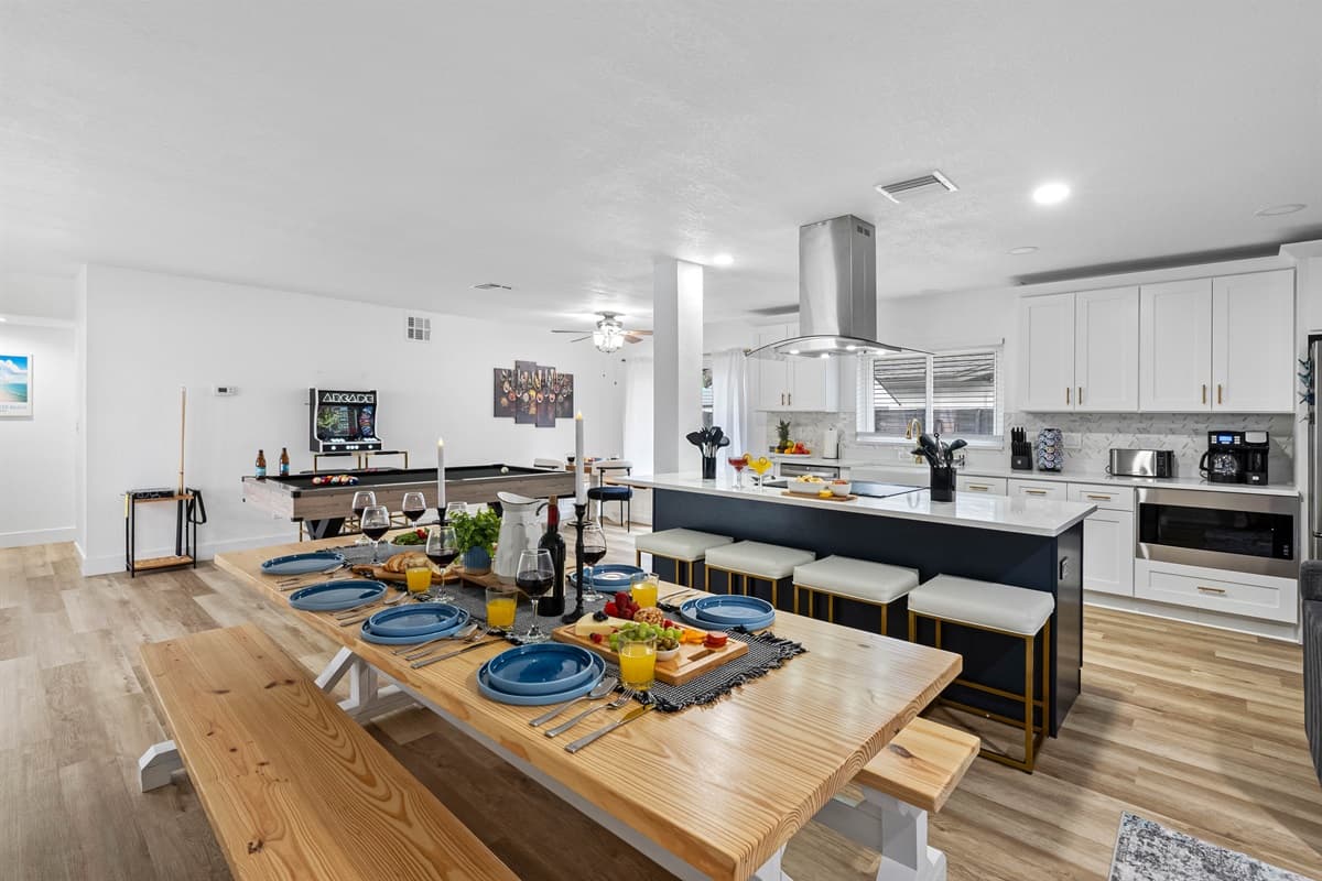 Enjoy meals together at this spacious table, just steps from the kitchen and game room.