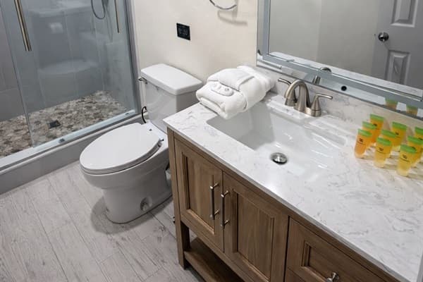 The soothing tones and clean finishes offer a relaxing retreat after a long day.