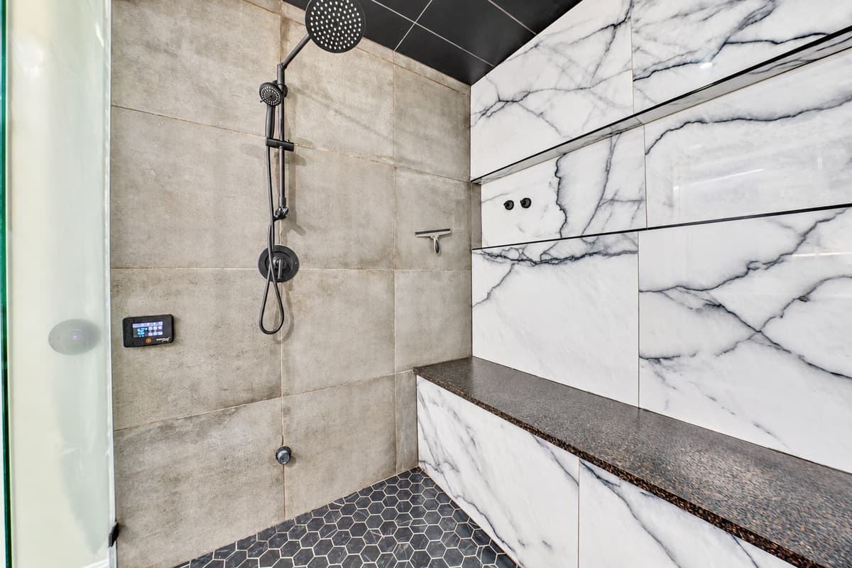 Rain shower, marble walls, and no one banging on the door.
