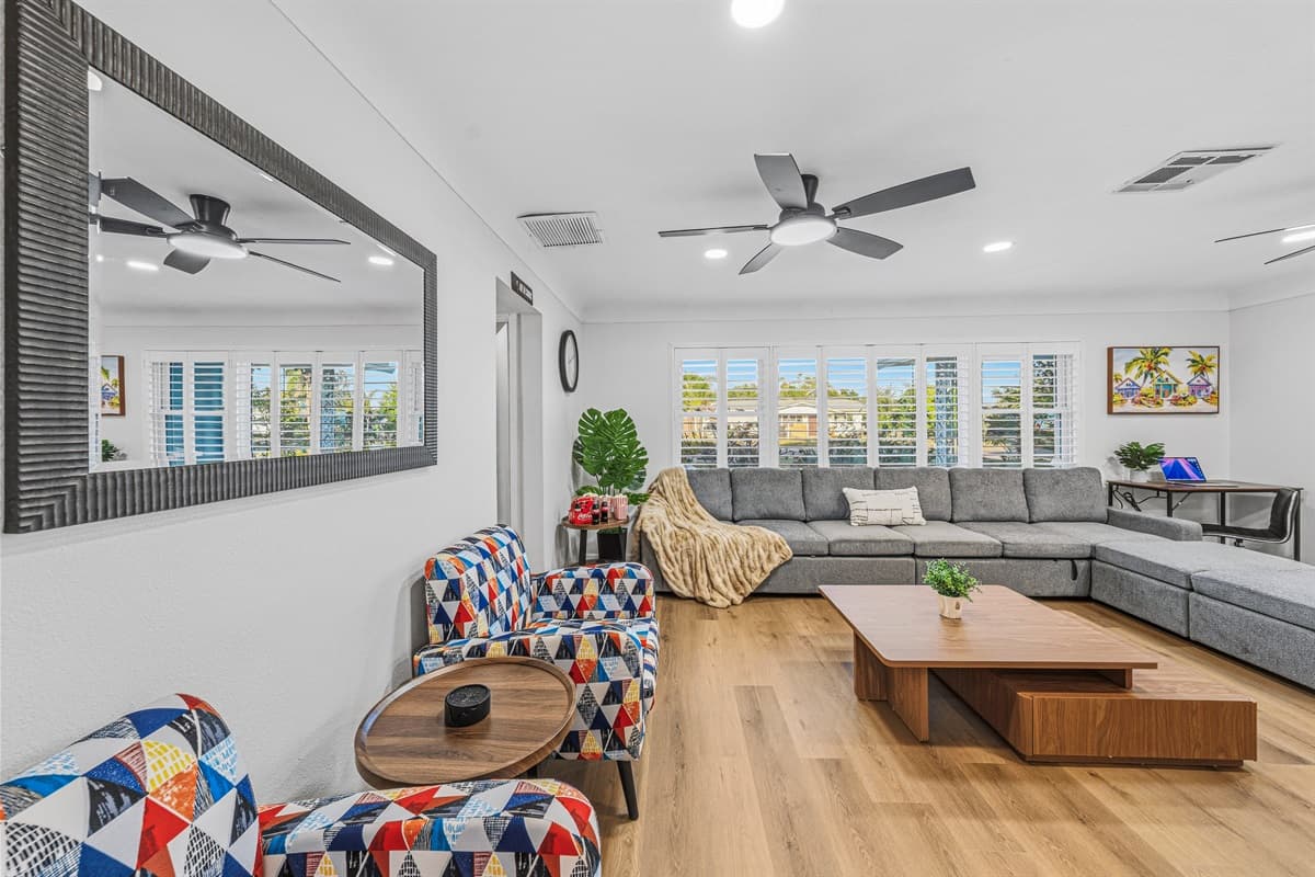 Spacious living room with large sectional seating, perfect for relaxing and gathering with your group 