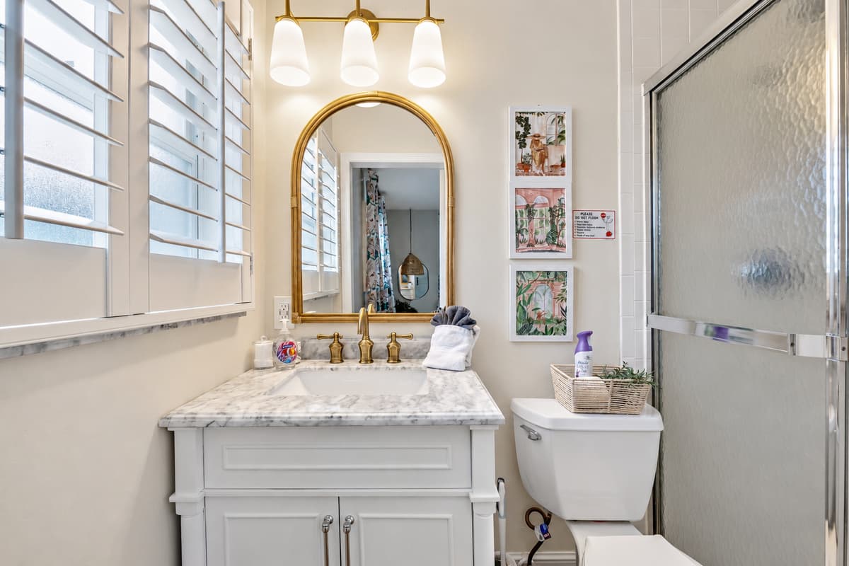 Soft, ambient lighting throughout the bathroom enhances its tranquil atmosphere.