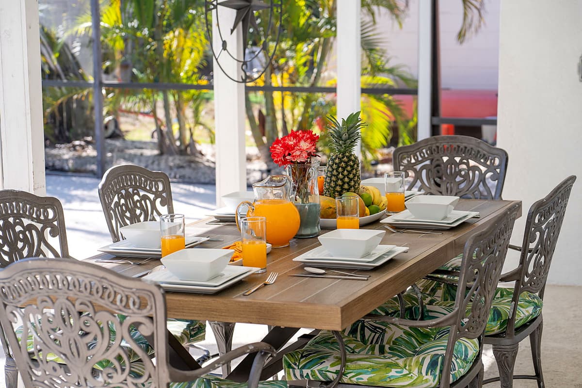 Enjoy a delightful alfresco dining experience by the pool, where the combination of fresh air, tranquil water views, and comfortable seating creates the perfect setting for meals with family and friends.