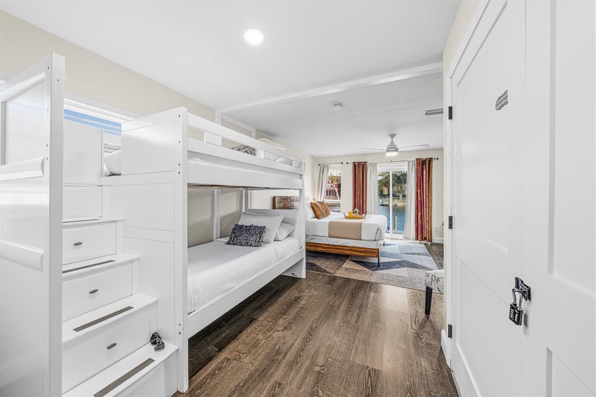 Large family suite with a king bed, bunk beds, and plenty of space for everyone.