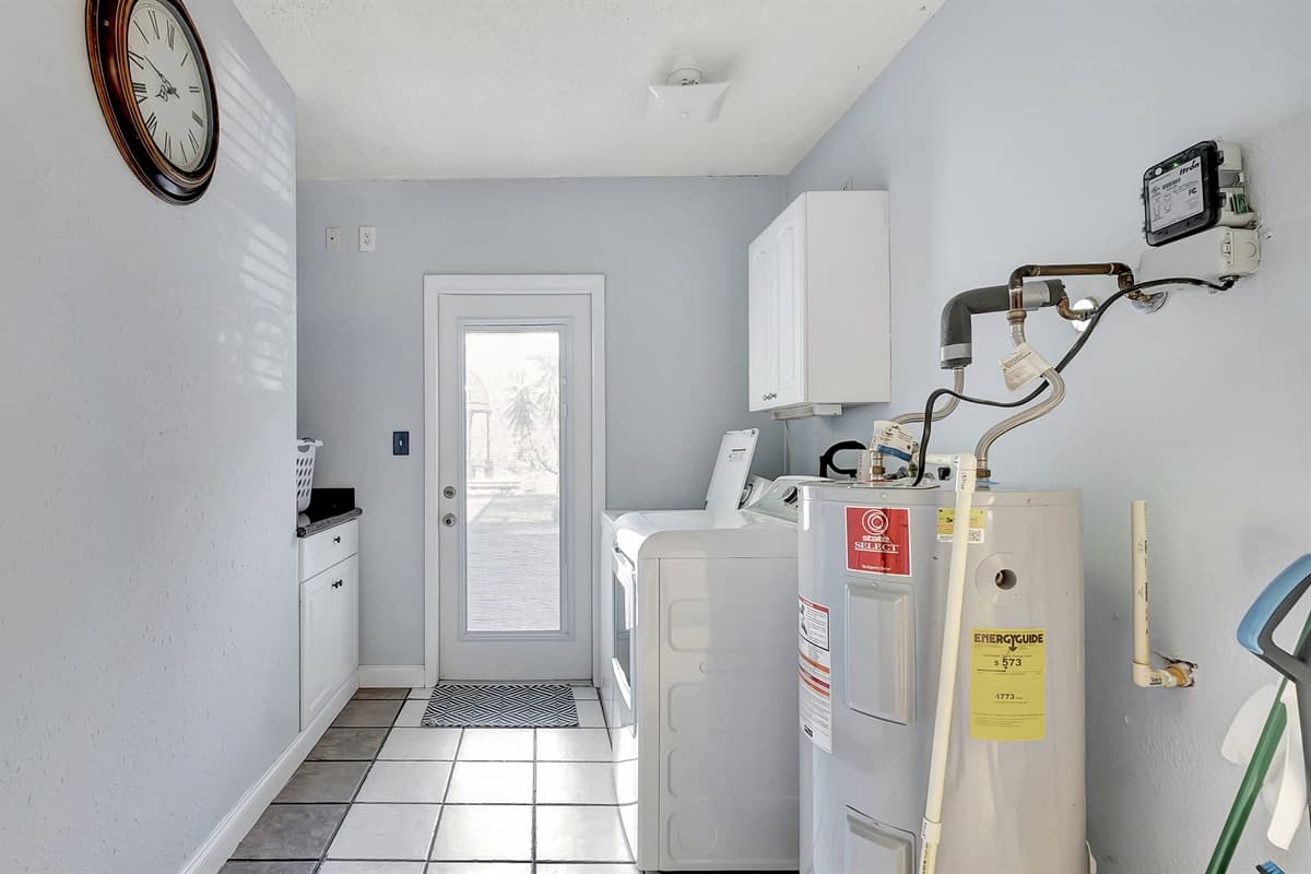Streamline your routine in this sleek and organized laundry space – because clean clothes should come with a side of convenience.