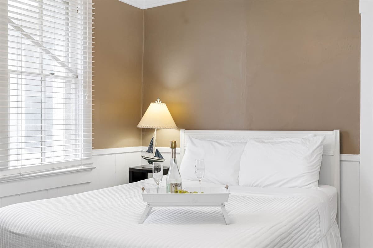 Thoughtfully chosen decor adds a touch of elegance and warmth, making this bedroom feel like a true sanctuary.