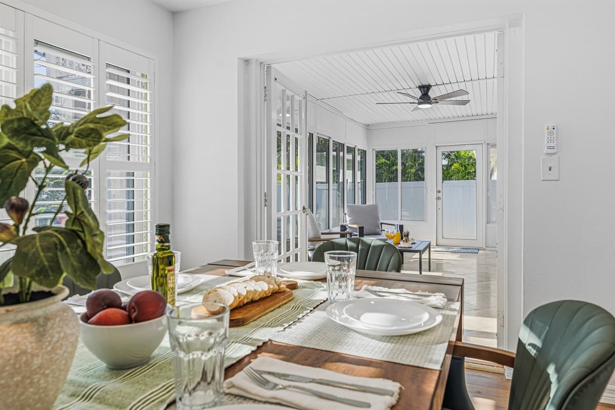 Close-up of dining table setup in a sunlit room, perfect for enjoying meals together 
Table settings and food are for staging purposes only and are not included.