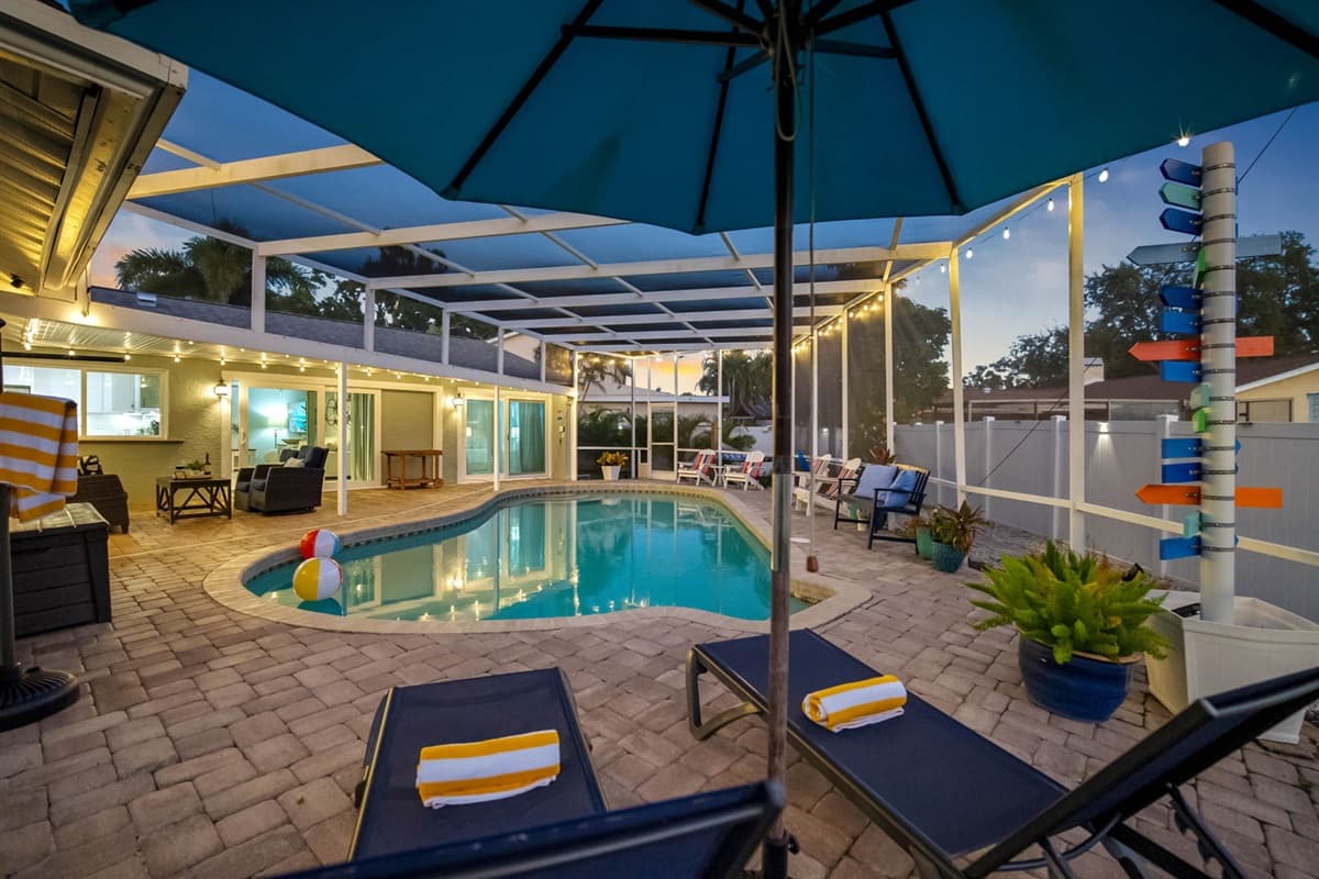 Step outside to a spacious screened patio featuring a private pool, cozy seating areas, and seamless access from multiple rooms of the home—bringing indoor comfort outdoors.