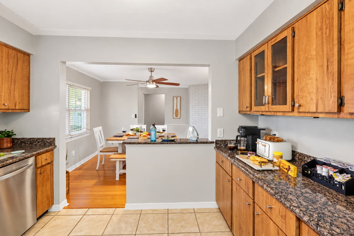 Gather, dine, and connect in this coastal-chic dining space with seating for six and easy flow to the kitchen.