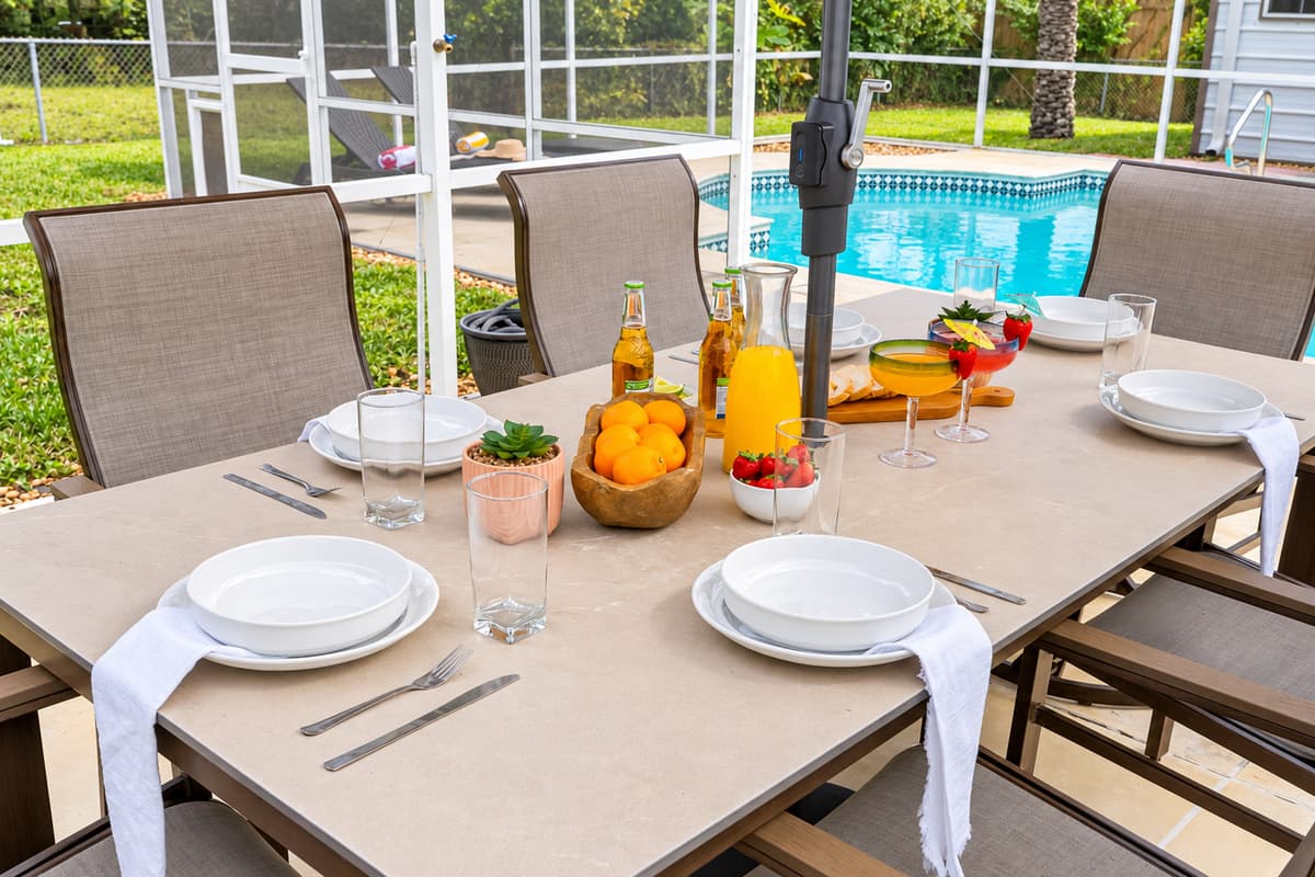 Gather around the table for unforgettable meals in this beautifully designed screened lanai.