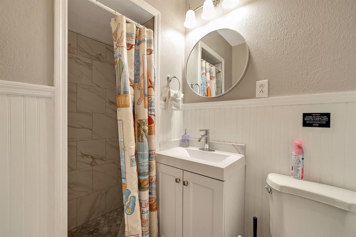 Surrounded by tasteful tiles and adorned with thoughtful accents, the bathtub is not just a fixture but a statement of luxury.