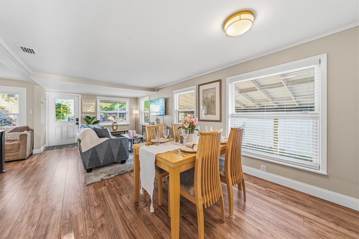 Open dining and living area with plenty of natural light and a seamless layout.