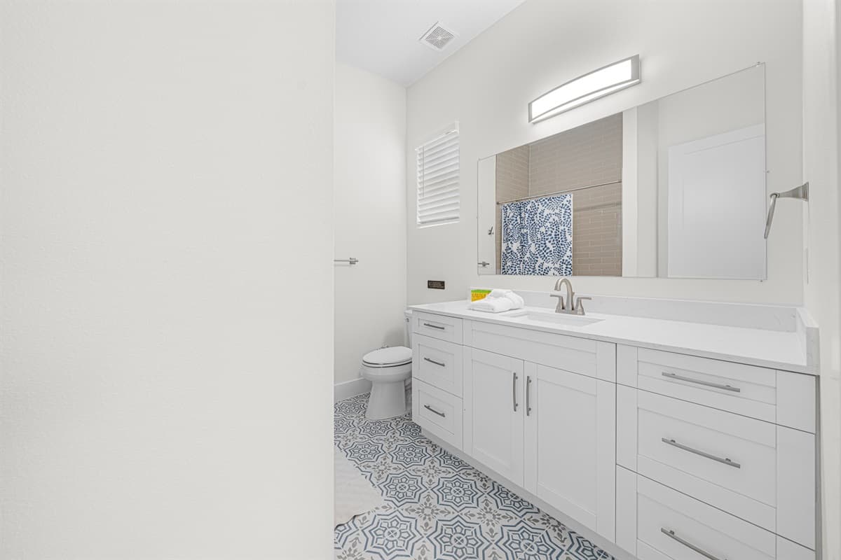 Double vanity bathroom with ample counter space and modern finishes.