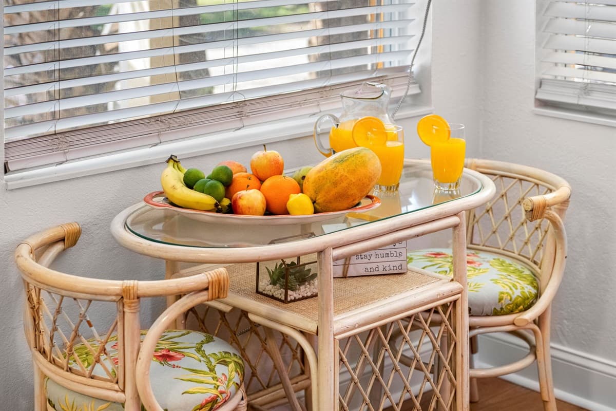 The tabletop is adorned with tropical-inspired patterns, evoking the essence of a breezy island retreat.